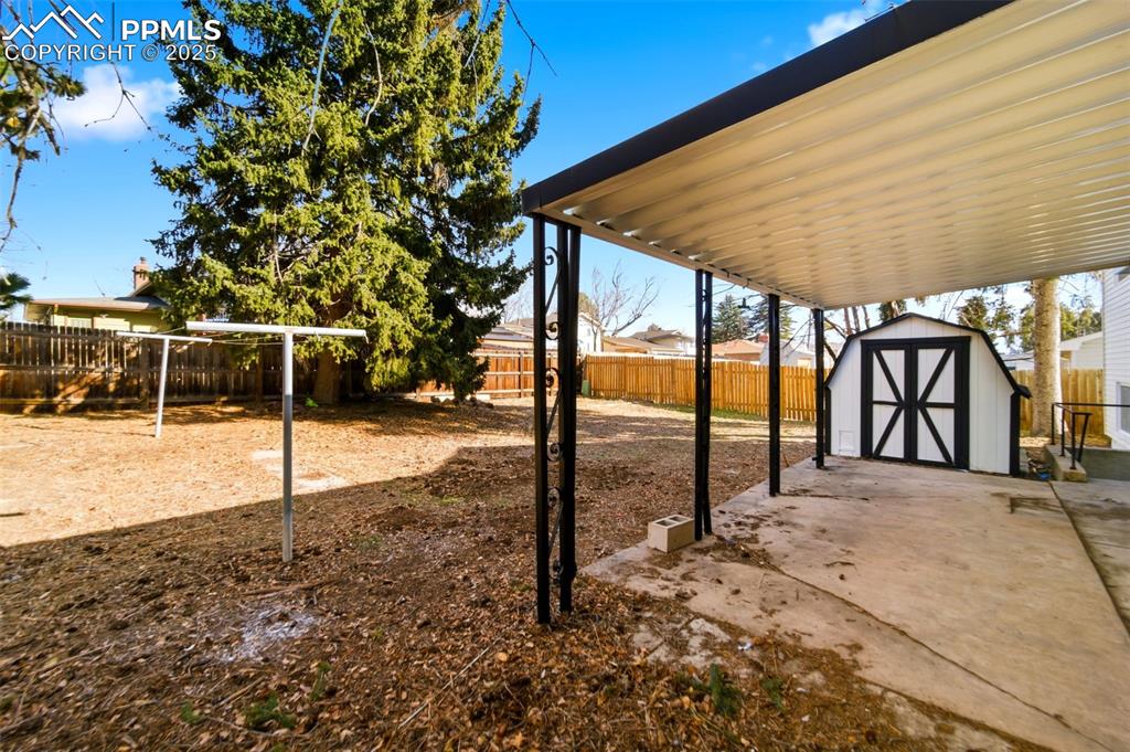 Image 32 of 41: Covered rear patio area