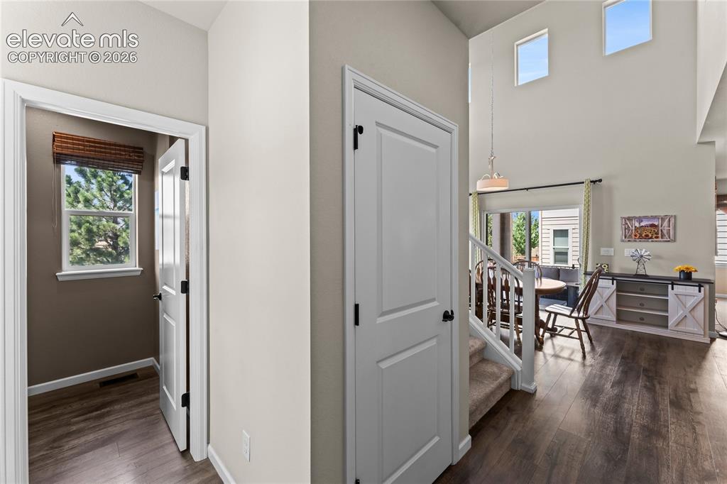 Image 19 of 41: Hallway on upper level with built-in cabinetry