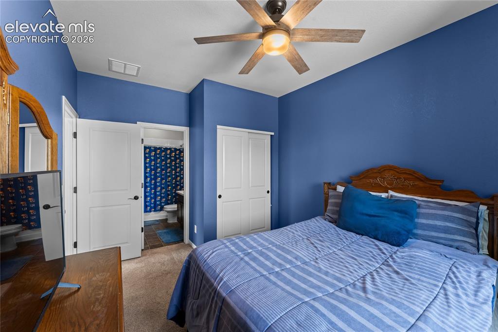 Image 32 of 41: Large walk-in closet in primary bedroom