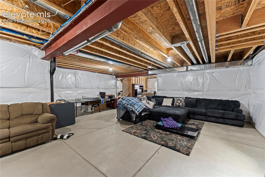Image 40 of 49: Unfinished basement that is already insulated.