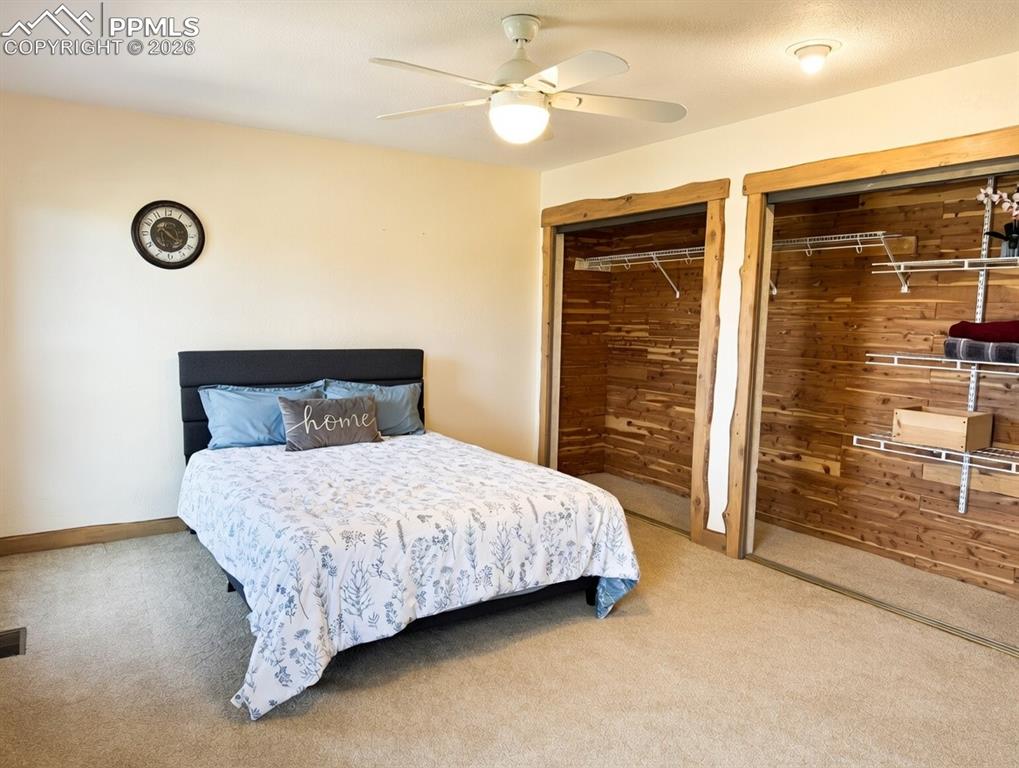 Image 23 of 39: Bedroom #2 on main level with adjoining bathroom. Could be a secondary prim