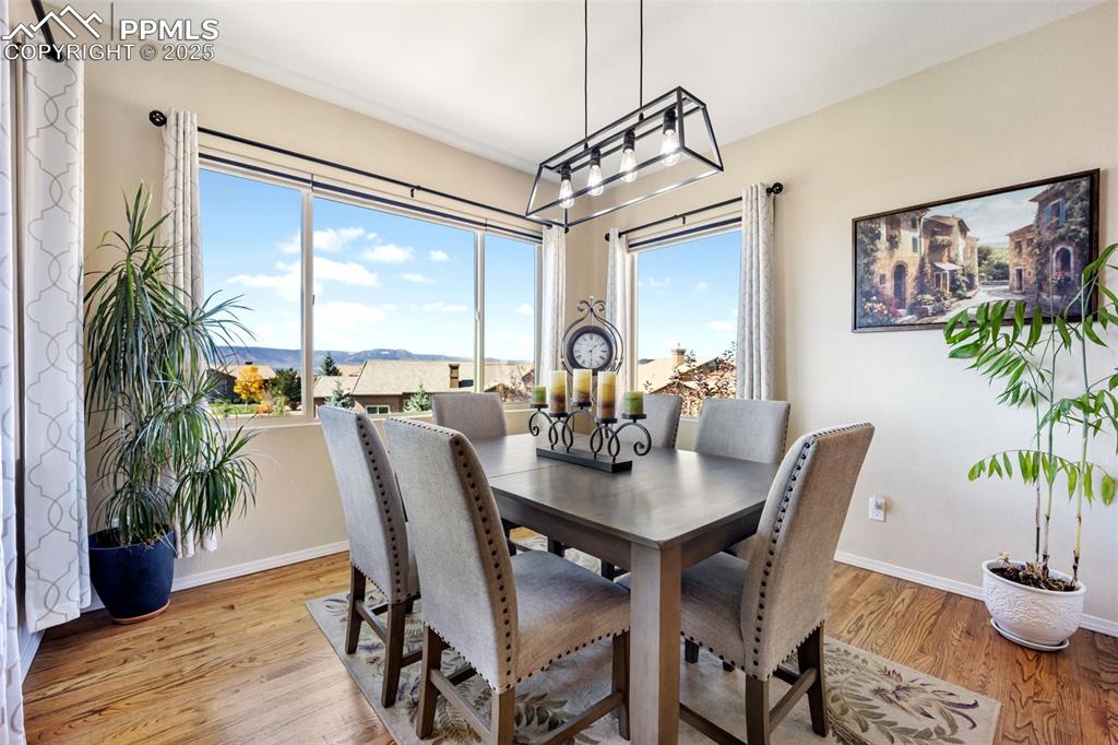 Image 17 of 50: Dining area featuring plenty of natural light and light wood-style floors