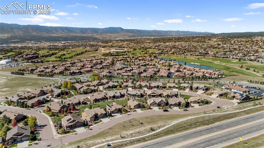 Image 48 of 50: View of property location with nearby suburban area and a water and mountai