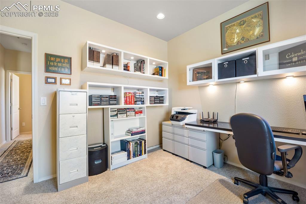 Image 6 of 50: Office with light carpet and recessed lighting