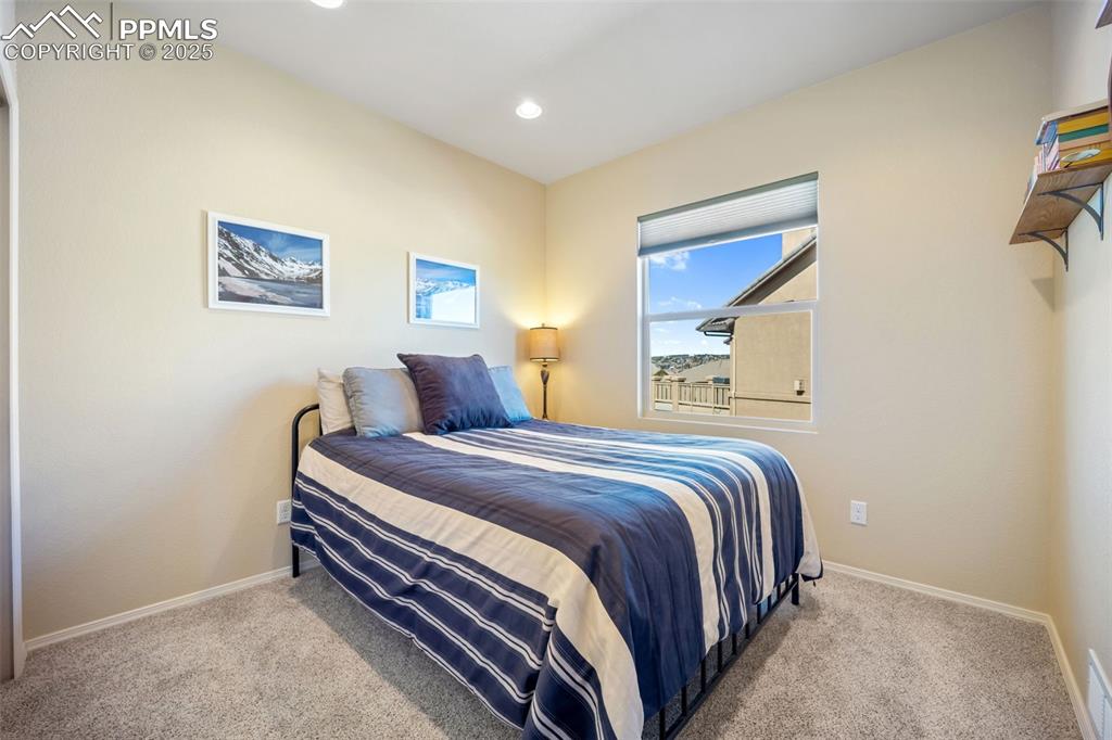 Image 8 of 50: Carpeted bedroom featuring baseboards and recessed lighting