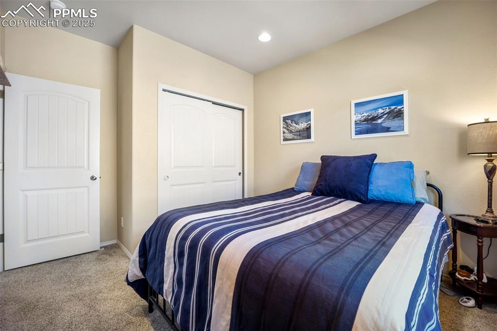 Image 9 of 50: Carpeted bedroom featuring a closet and recessed lighting