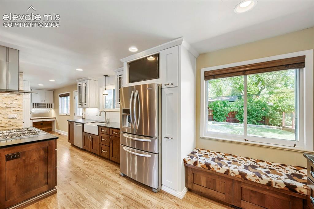 Image 12 of 41: Sitting area window bench in kitchen area!