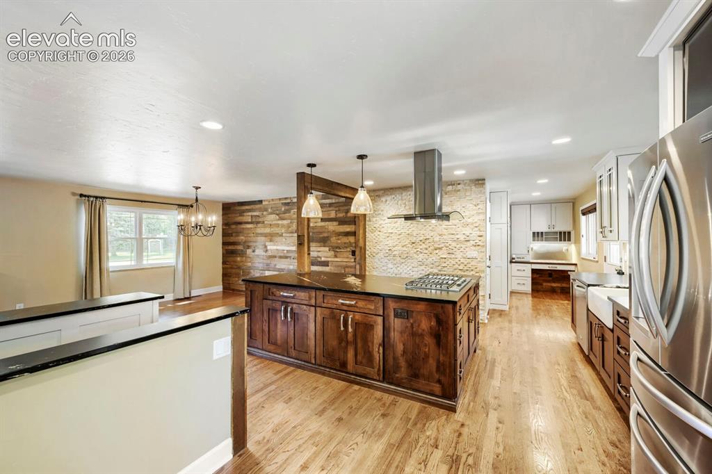 Image 13 of 41: View through the gourmet custom kitchen!