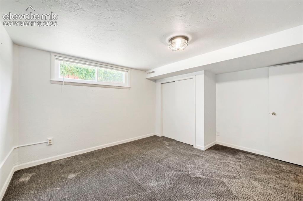 Image 32 of 41: Lower bonus room, great for a gym or office!