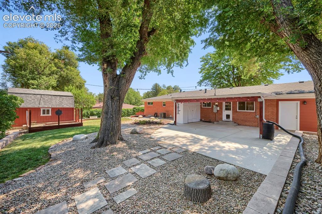Image 33 of 41: Professionally landscaped, irrigation, garden beds, perennial garden, shade