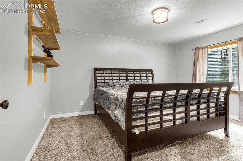 Image 34 of 48: Basement Bedroom
