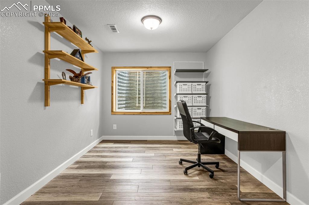 Image 36 of 48: Basement Office in between Bedrooms