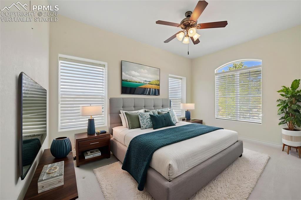 Image 32 of 48: main floor bedroom
virtually staged