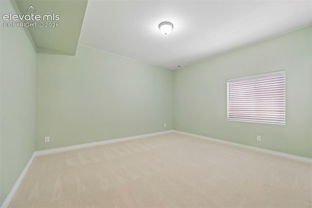Image 45 of 50: basement bedroom