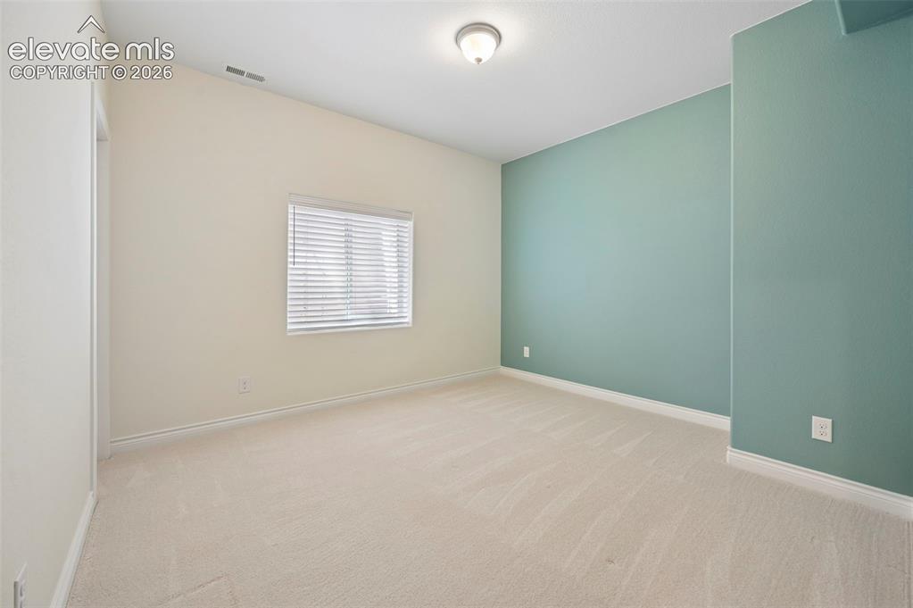 Image 47 of 50: basement bedroom
