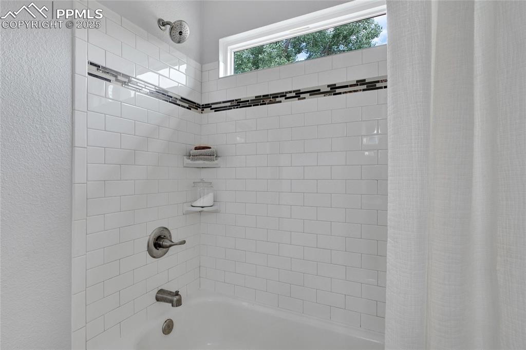 Image 18 of 44: Full bath featuring shower / bath combination with curtain