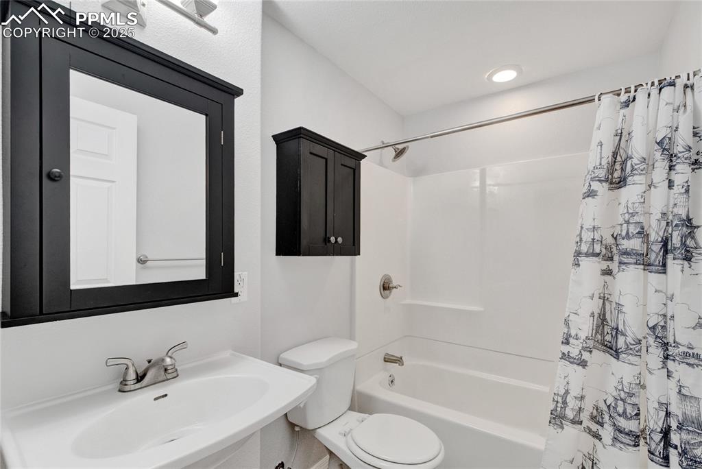Image 35 of 44: Full bath featuring toilet and shower / bath combo