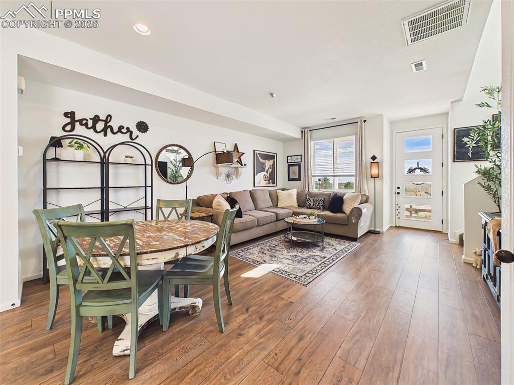 Image 10 of 50: Living/Dining Area – Open dining and living combination with warm flooring 