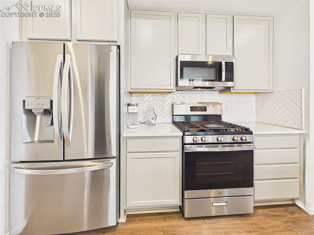 Image 19 of 50: Kitchen Appliances – Well-appointed kitchen featuring stainless steel appli