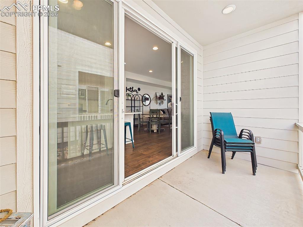 Image 23 of 50: Covered Patio – Private covered patio provides a comfortable outdoor retrea