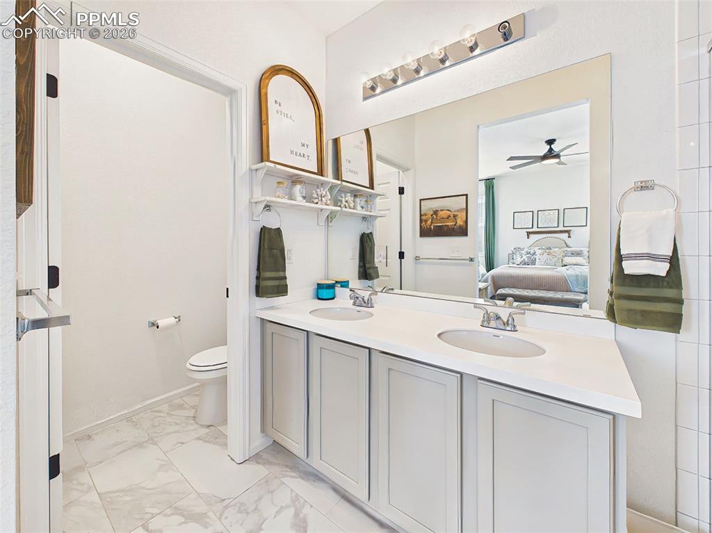 Image 28 of 50: Primary Bathroom – Bright primary bathroom featuring dual vanities, modern 