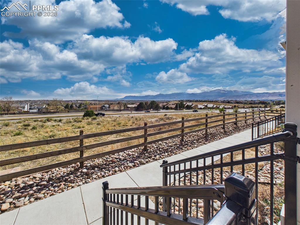 Image 41 of 50: Porch View – Covered front porch with stunning mountain and open-space view