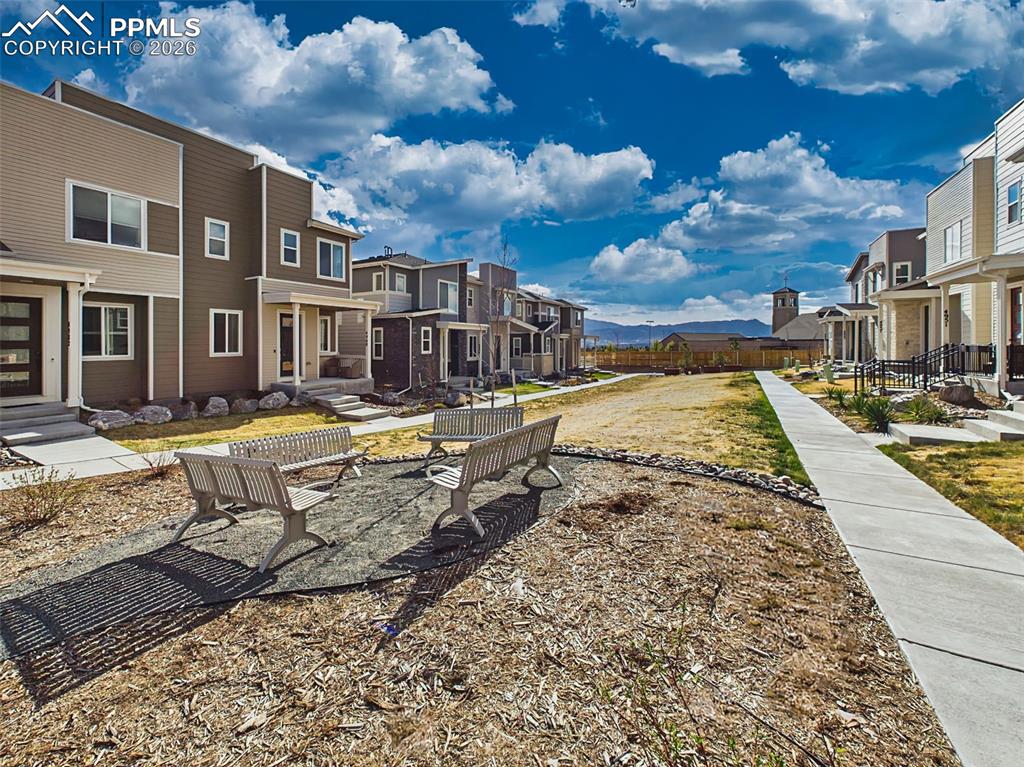 Image 45 of 50:  Community Space – Shared greenbelt/common area with seating and walkable p