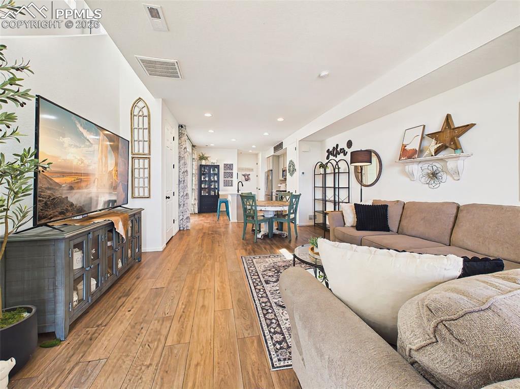 Image 5 of 50: Living Room – Bright and spacious living area with expansive windows, reces