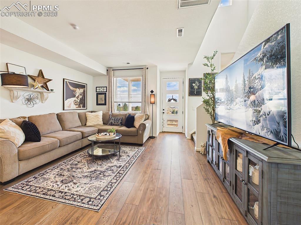 Image 9 of 50: Living Room – Generous open living space with seamless flow into dining and