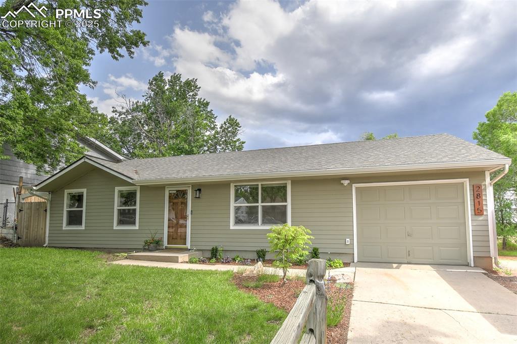 Image 2 of 25: Single story home featuring roof with shingles, concrete driveway, and an a