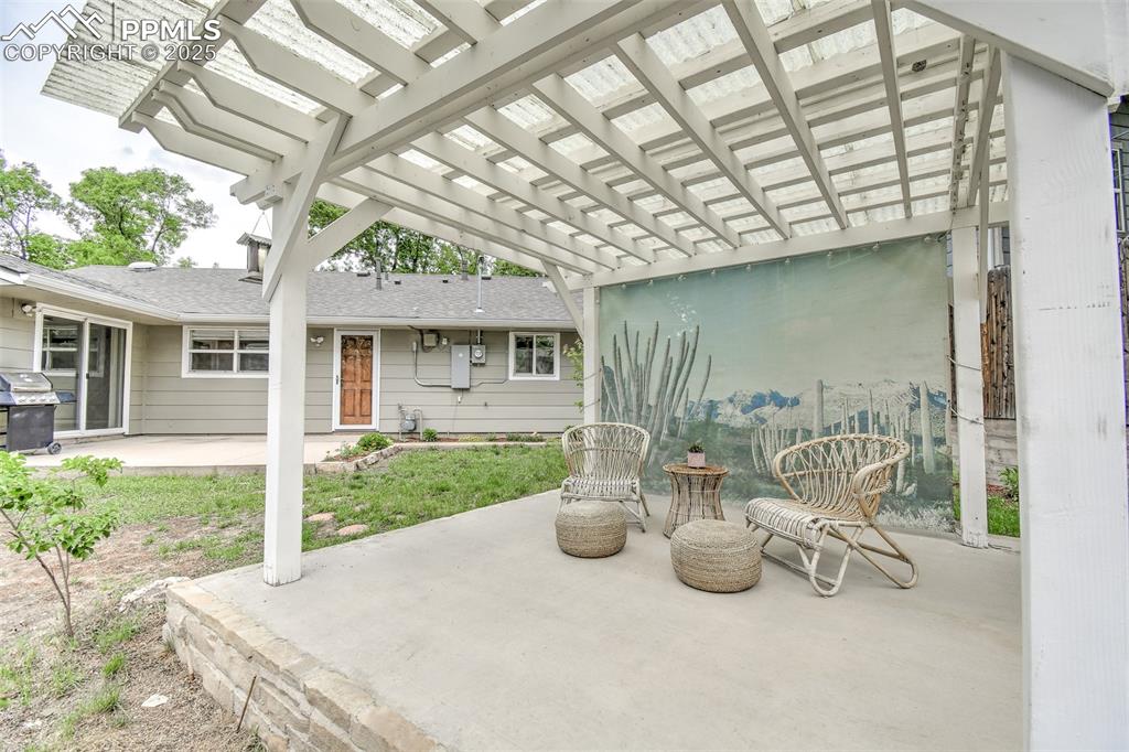 Image 24 of 25: View of patio / terrace with a grill and a pergola