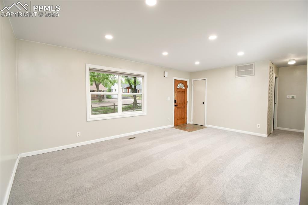 Image 4 of 25: Spare room featuring recessed lighting and light colored carpet