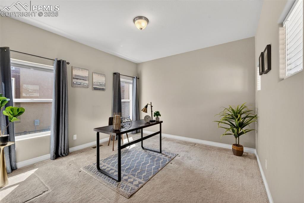Image 7 of 34: Home office featuring light colored carpet