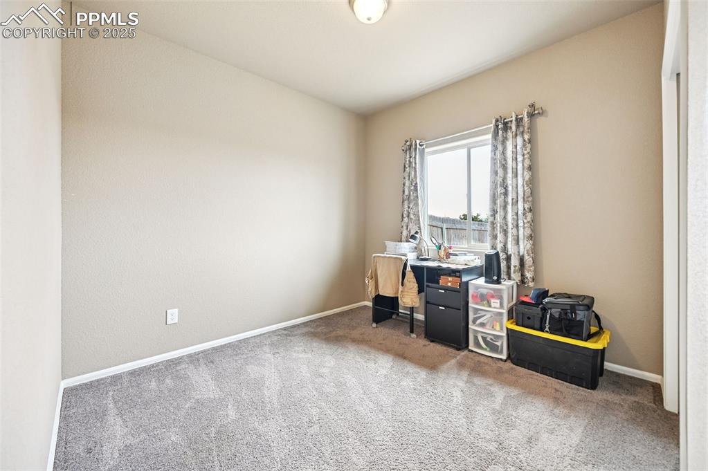 Image 18 of 29: Office area with carpet and baseboards
