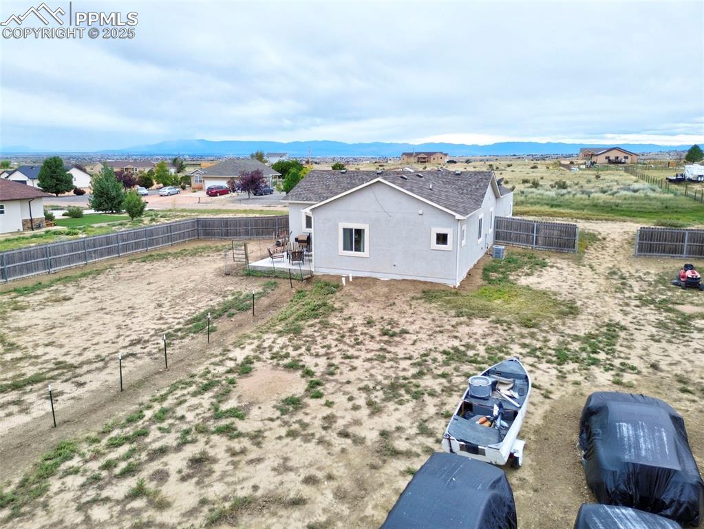 Image 26 of 29: Aerial view of property and surrounding area with mountains