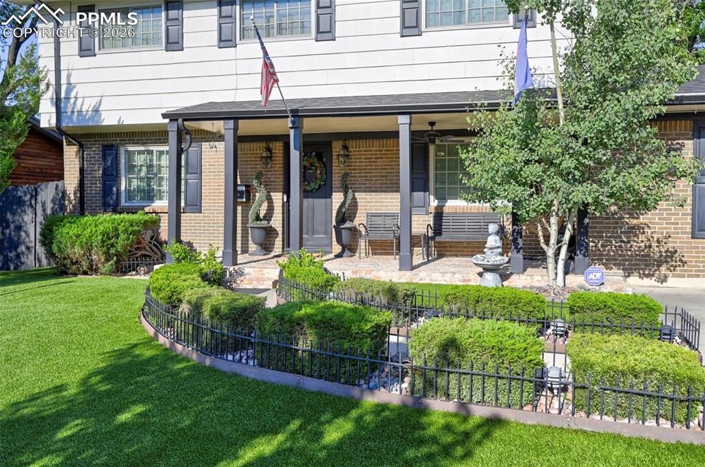 Image 2 of 46: Doorway to property featuring brick siding