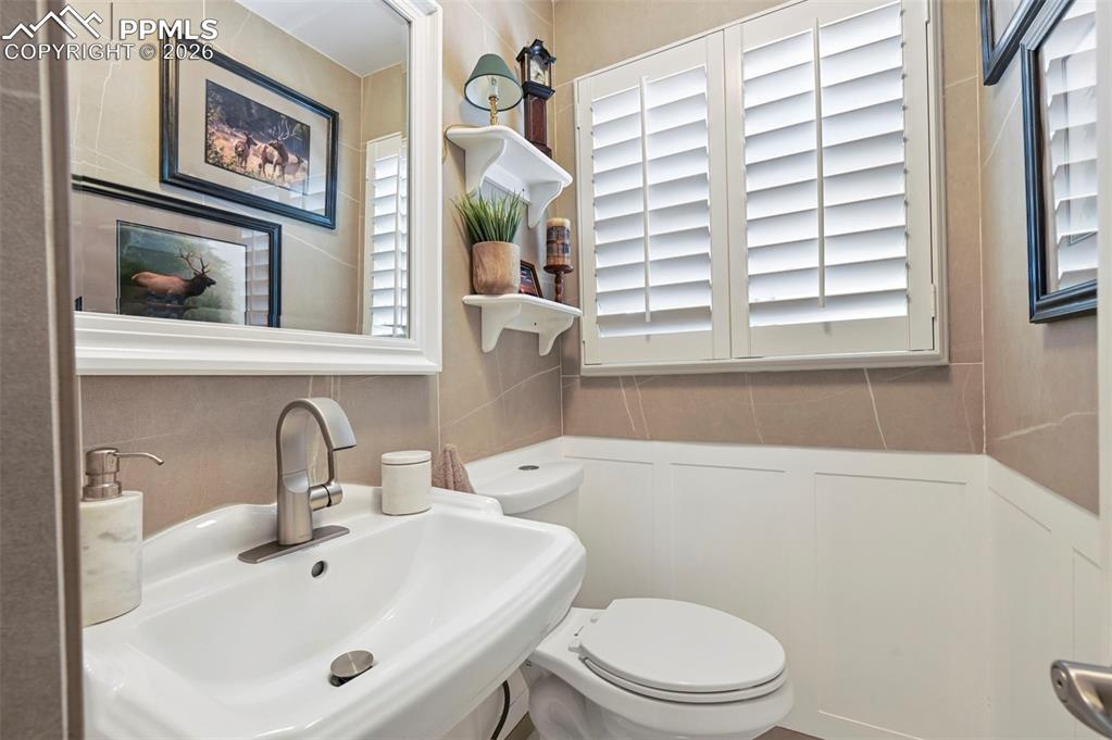 Image 22 of 46: Bathroom featuring toilet and a sink
