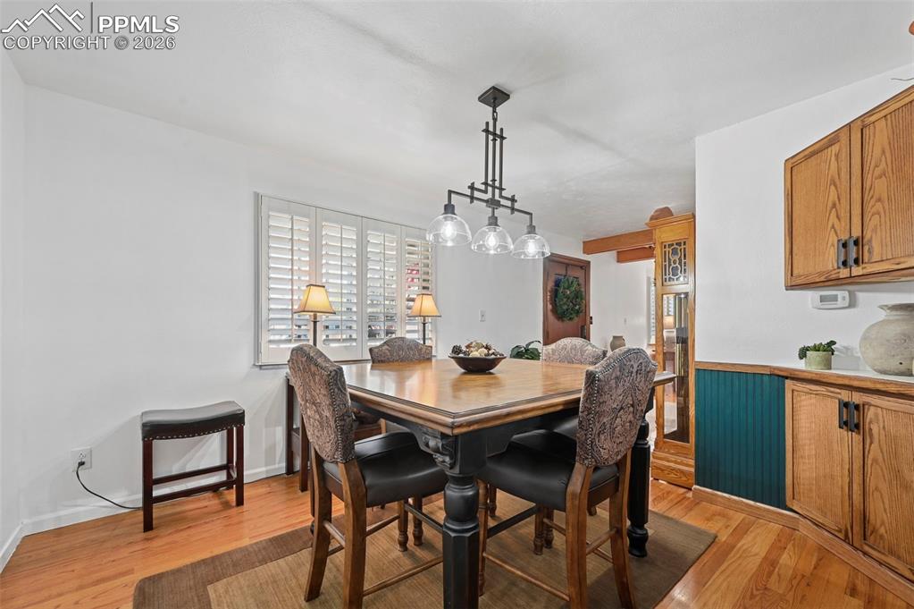Image 24 of 46: Dining area with light wood-style floors
