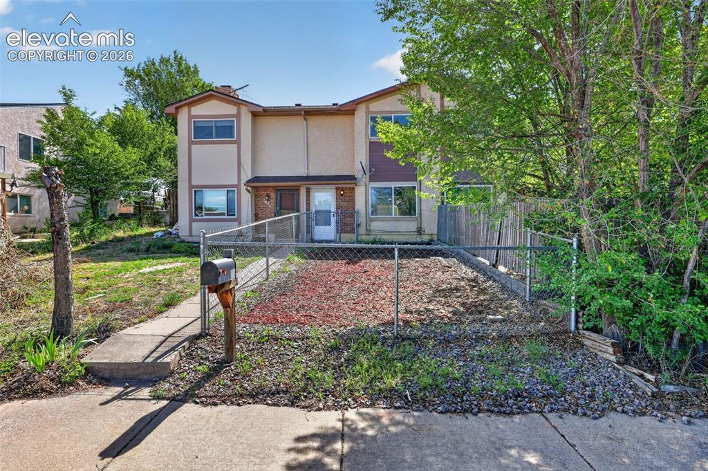 Image 1 of 28: Multi-level exterior with stucco and brick accents