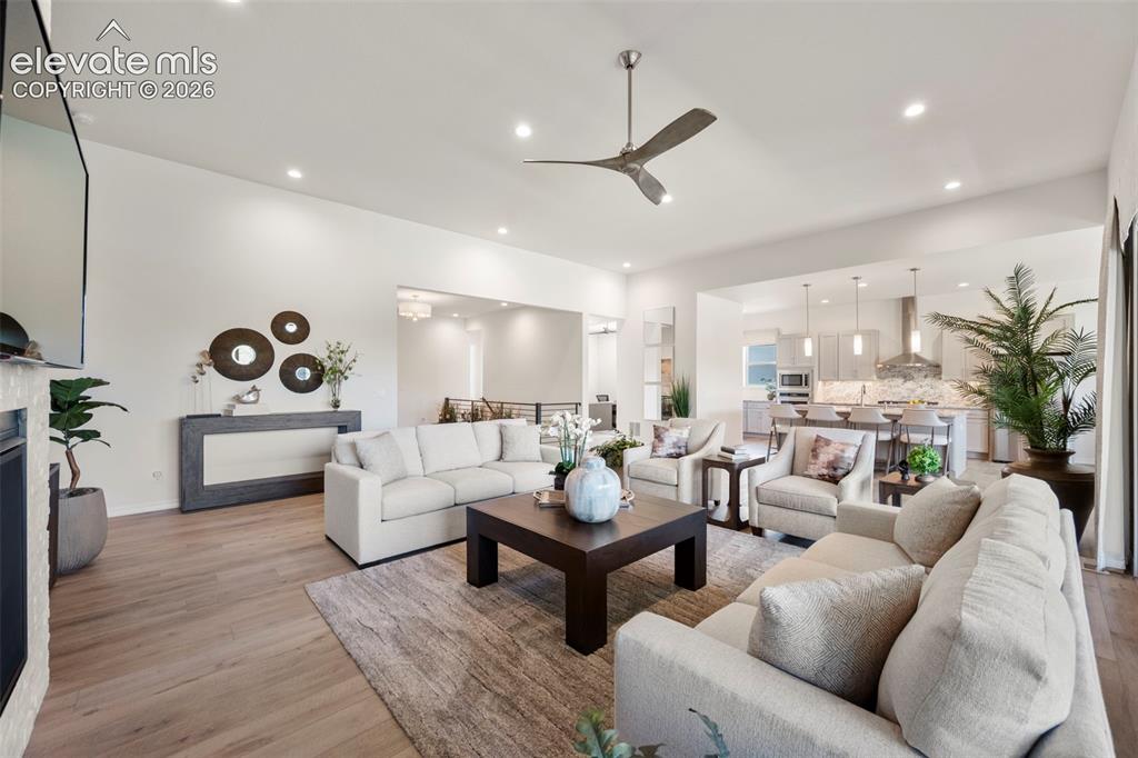 Image 10 of 50: Beautiful flooring throughout, recessed lighting, and a contemporary ceilin