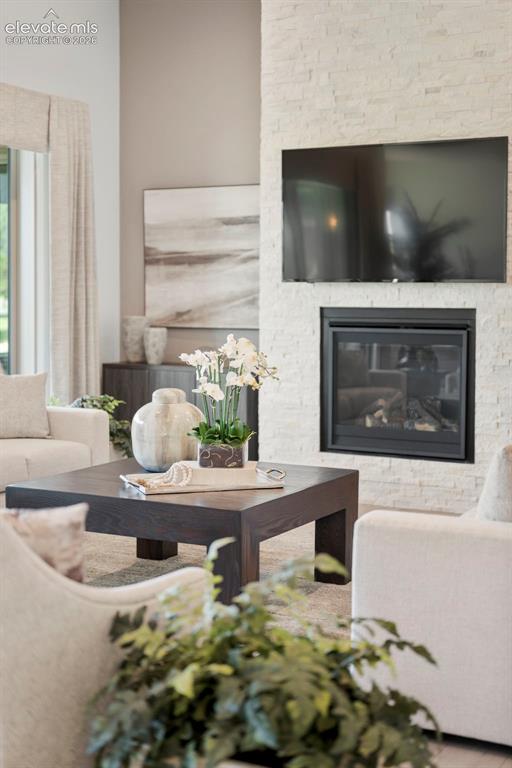 Image 11 of 50: Floor-to-ceiling stacked stone fireplace 