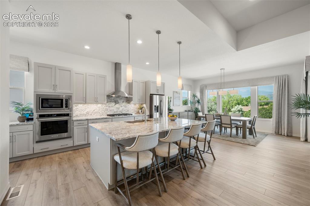 Image 14 of 50: Open-concept kitchen and dining area