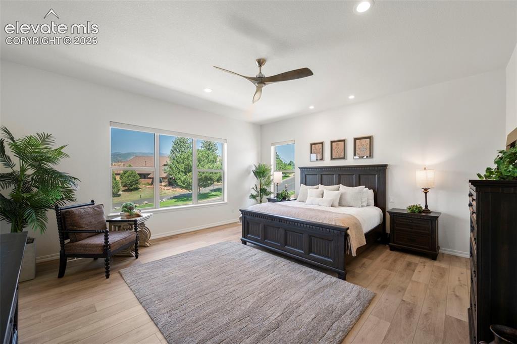 Image 18 of 50: Recessed lighting, beautiful flooring, and multiple windows providing ample