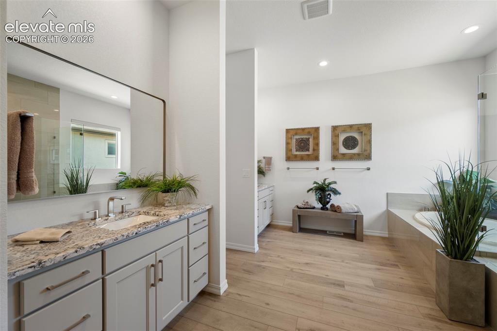 Image 20 of 50: Beautiful spacious 5 piece bathroom and large walk-in closet
