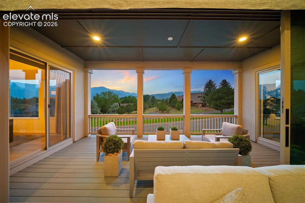 Image 42 of 50: Expansive covered deck with recessed lighting, composite decking, with balu