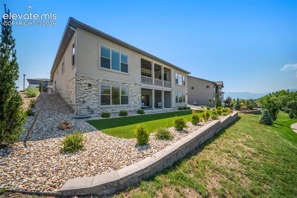 Image 43 of 50: Low maintenace landscaping with spectacular mountain and Pikes Peak views