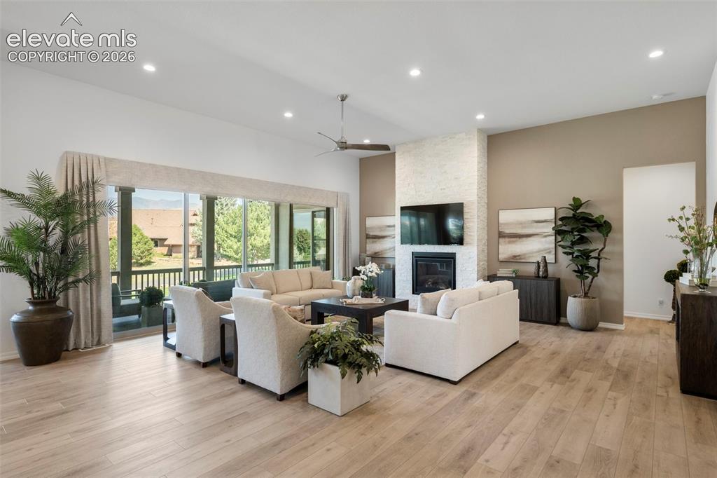 Image 8 of 50: Grande ceilings with recessed lighting, beautiful flooring, floor to ceilin