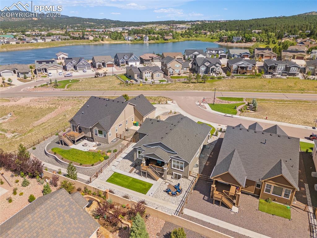 Image 30 of 41: Aerial view of residential area featuring a large body of water