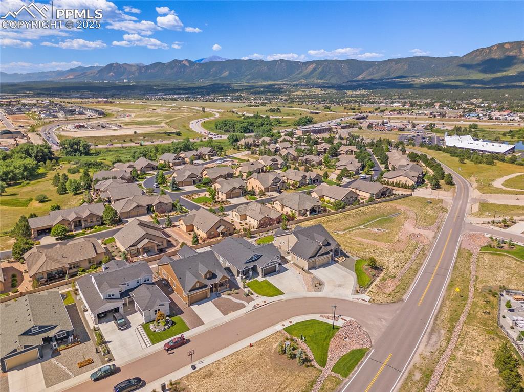 Image 34 of 41: Aerial view of property and surrounding area featuring nearby suburban area