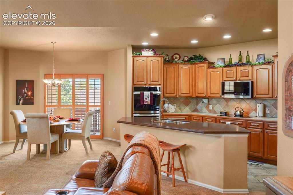 Image 10 of 36: Great room-style floor plan is open, light and bright